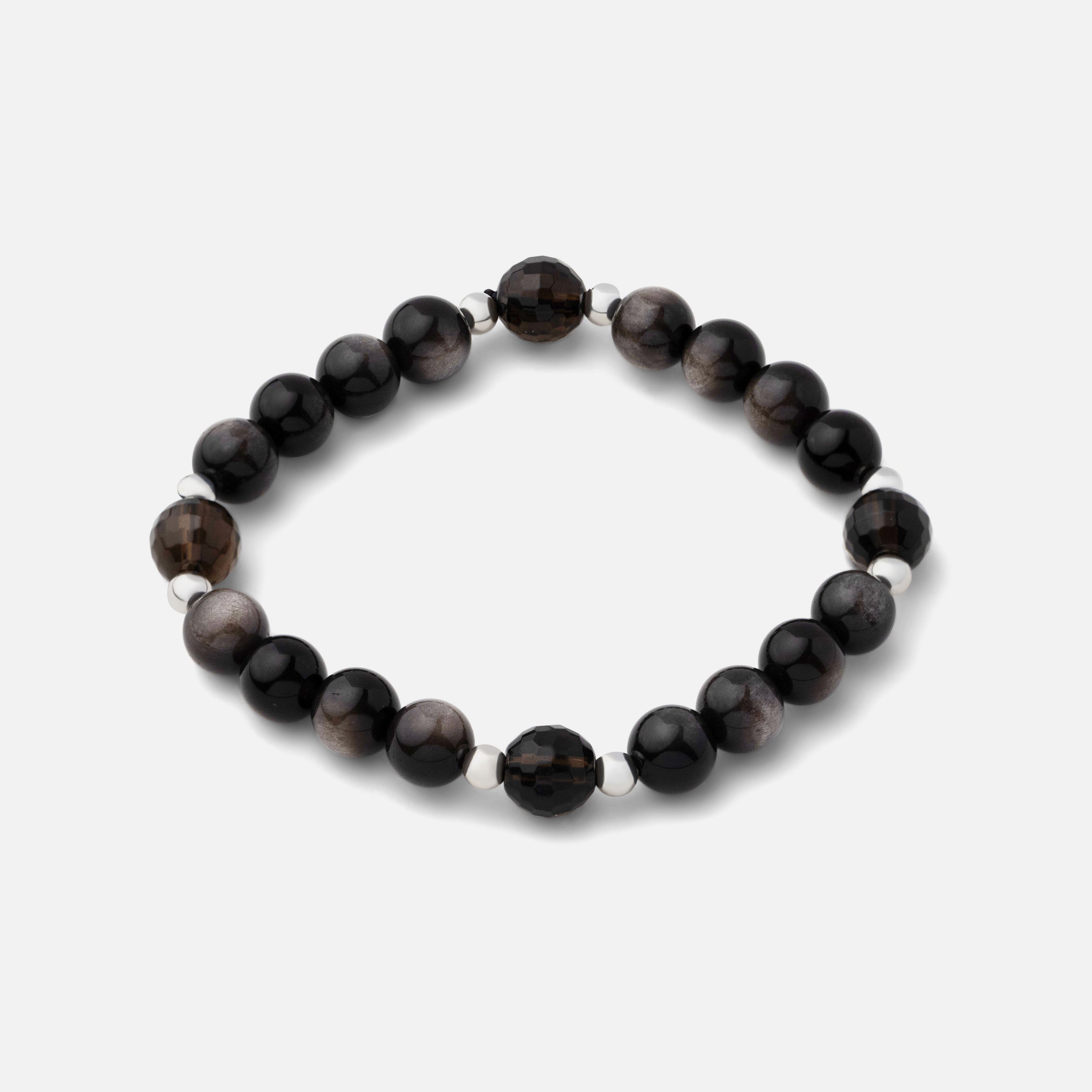 Bracelet featuring natural black silver sheen obsidian gemstone beads coupled with clear dark brown smoky quartz, creating a bold and resilient statement. Can be worn alone or layered with other silver pieces.