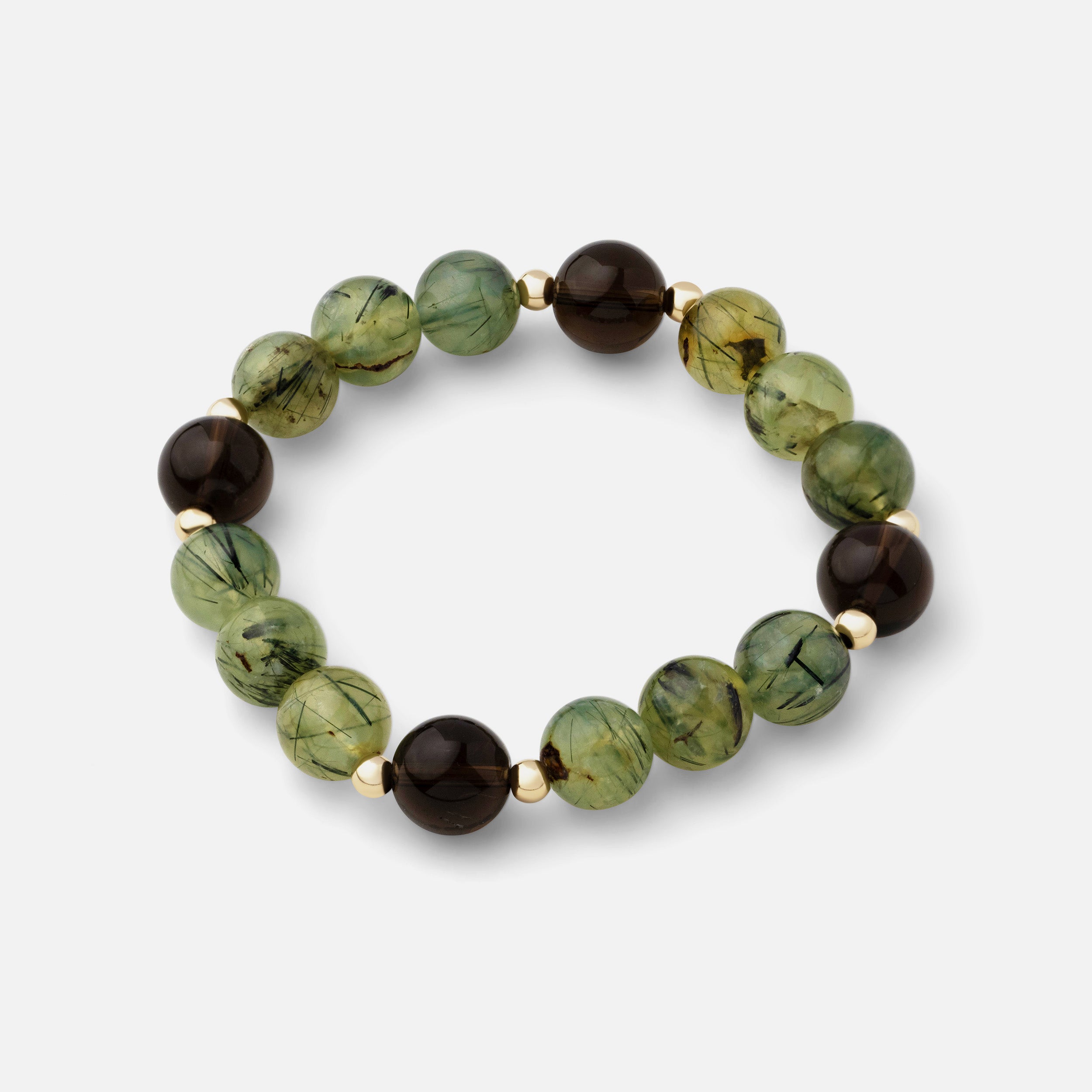 Bracelet featuring translucent greenish and yellow prehnite with black needle rutiles, paired with natural smoky quartz gemstones. This elegant piece makes a bold and effortless statement, perfect for mixing and matching with your collection.