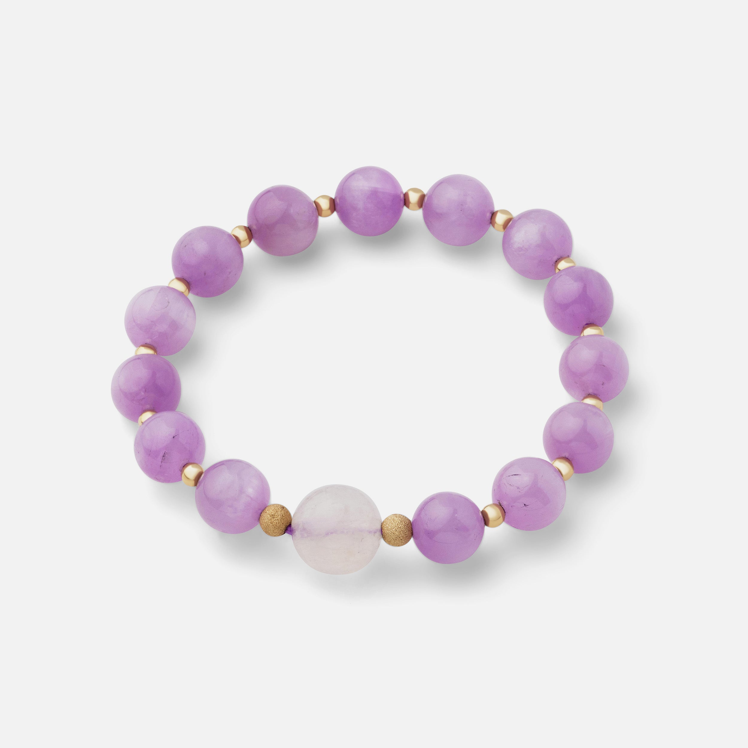 Beautiful pale pink and lavender kunzite paired with flashy moonstone in an elegant bracelet, offering a timeless style perfect for wearing alone or layering with other gold jewelry.