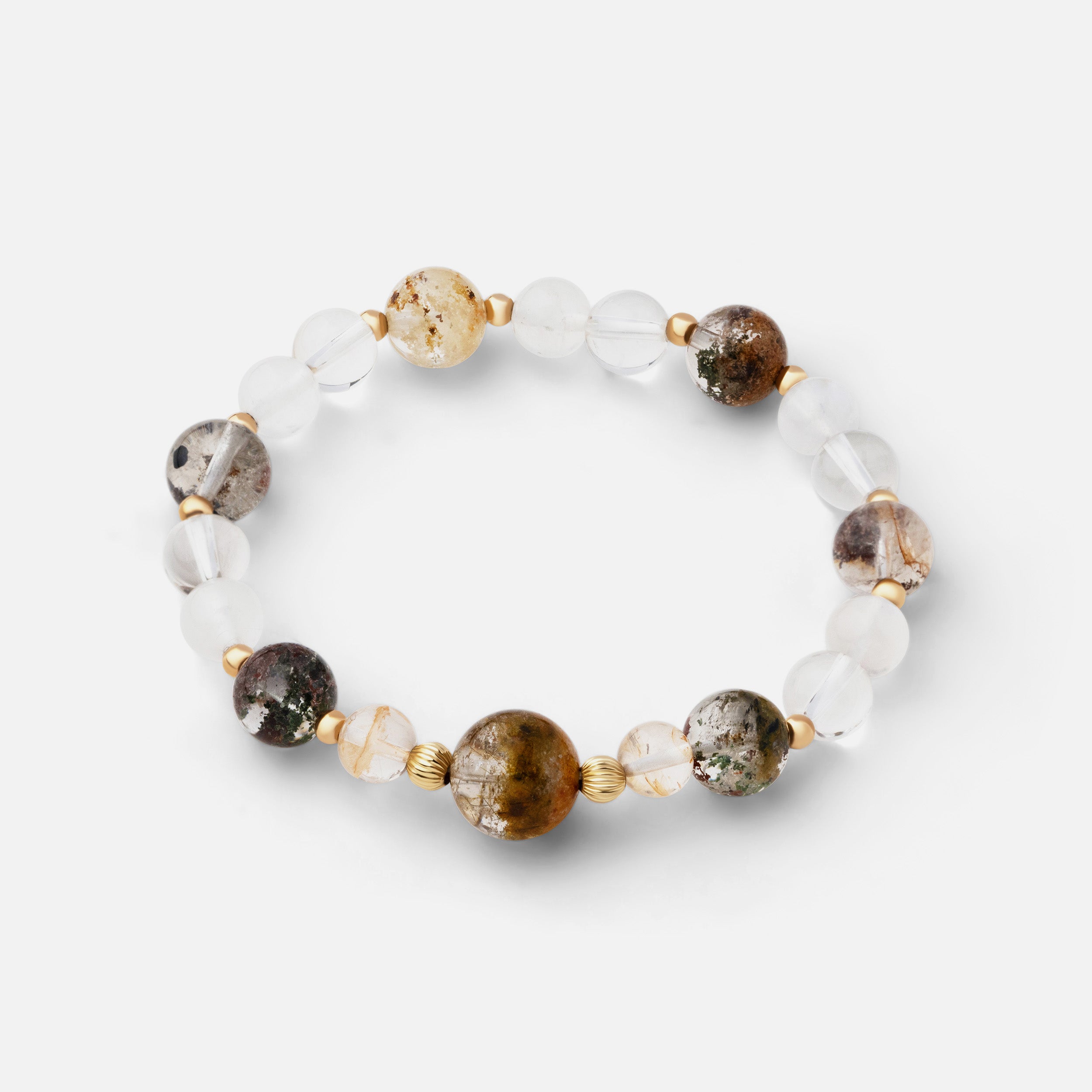 Delicate and versatile bracelet featuring beautiful inclusions of garden quartz paired with flashy moonstone and clear quartz, ideal for wearing from day to night.