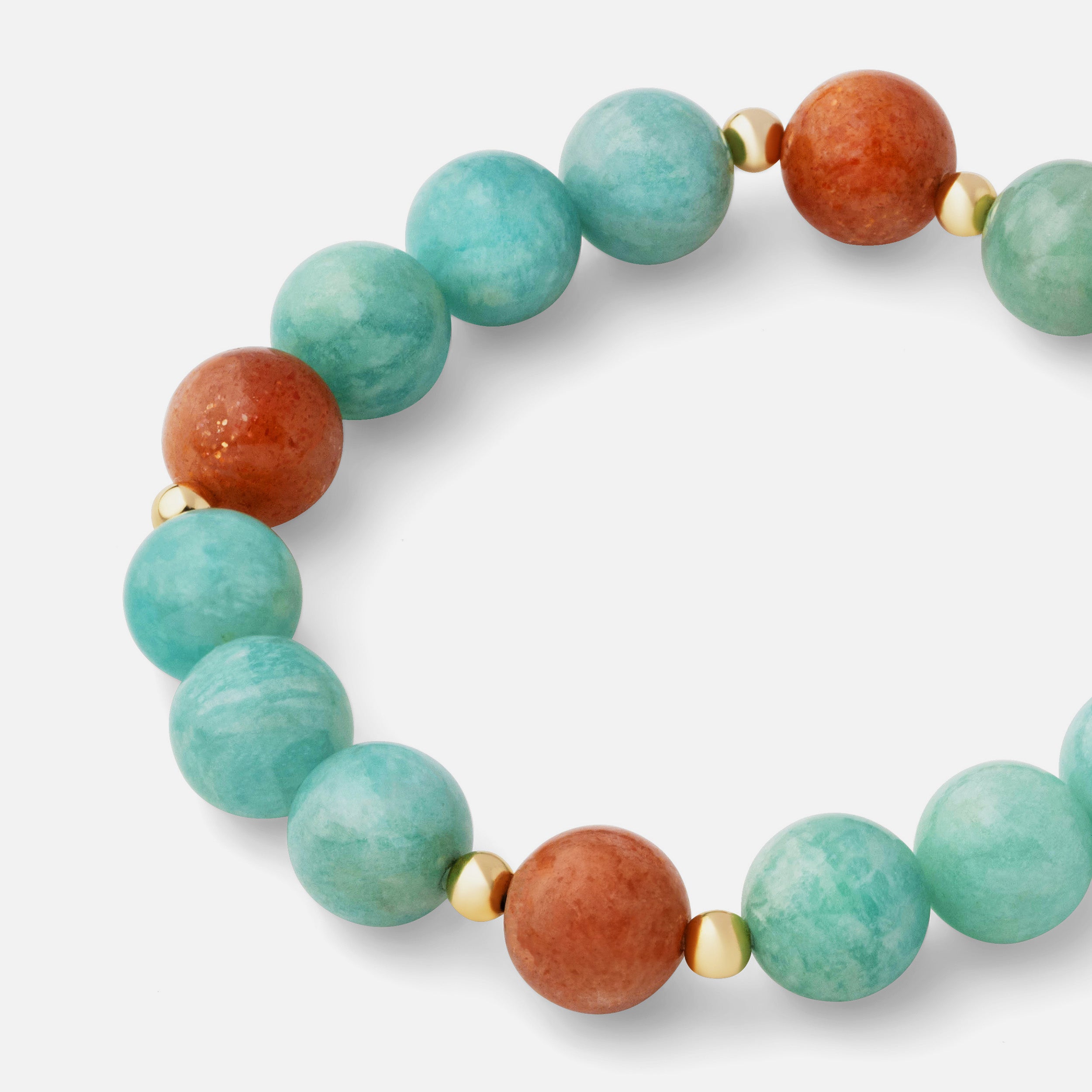 Close-up of a bracelet featuring the stunning ocean blue color of ice amazonite paired with sparkled sunstones, perfect for a day-to-night style.