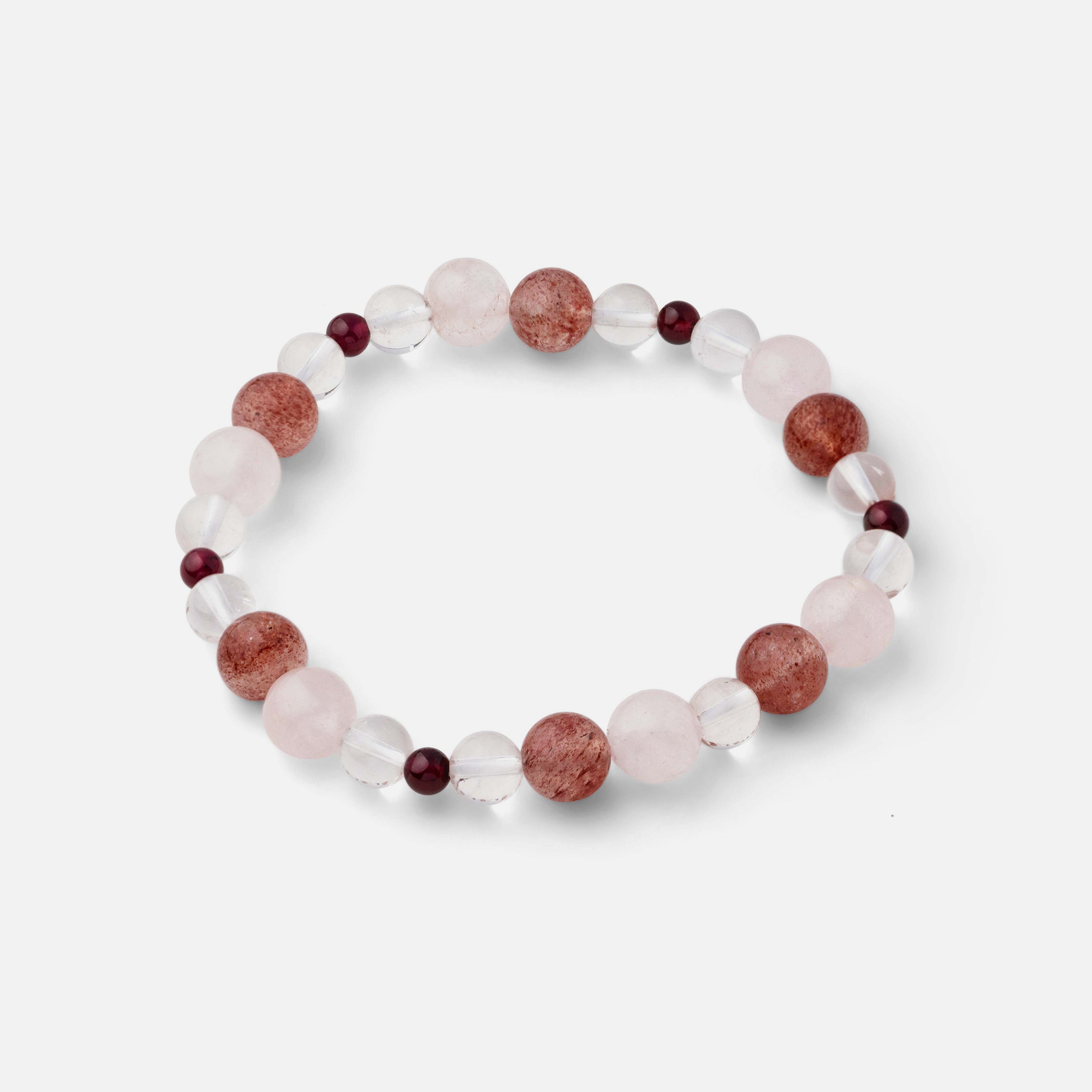 Bracelet featuring distinctive red strawberry quartz, blood red garnet, light pink rose quartz, and clear quartz accents, adding a refined touch to your look. Perfect for wearing solo or stacked with other bracelets.