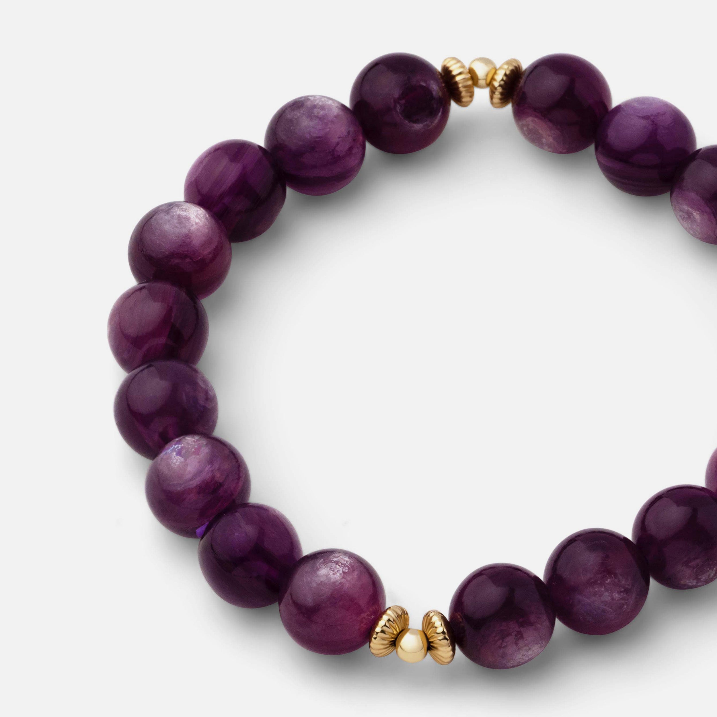 Close-up of a bracelet showcasing unique swirls of shimmering purple mica, highlighting its beauty for any season.