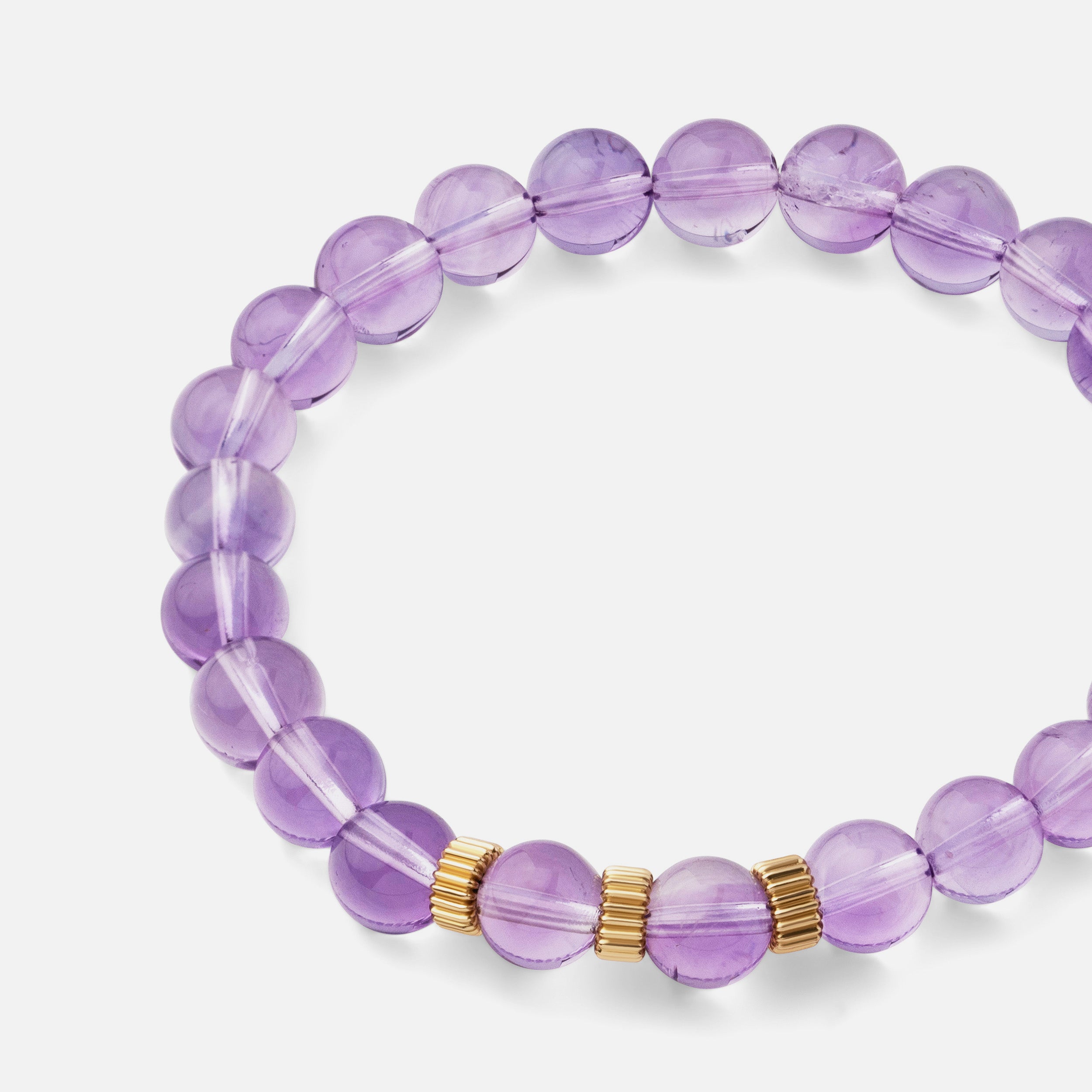 Close-up of a bracelet with natural top clarity purple amethyst, a delicate and versatile piece perfect for wearing from day to night