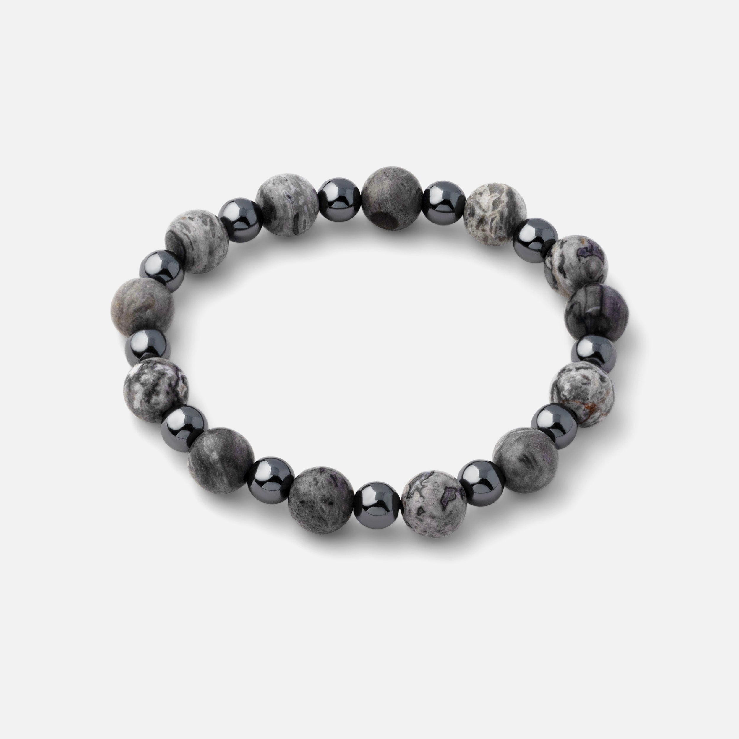 Bracelet featuring unique marble streaks of black, gray, and white natural picasso jasper paired with steel gray metallic hematite, making it a powerful statement piece perfect for casual outfits.